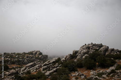 Spain, Malaga, Antequera, Torcal de Antequera: Rocks landscape with foggy background