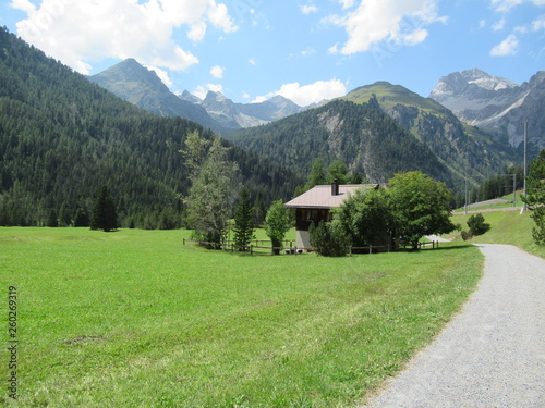 House in fields near Preda  Switzerland. Mountain background