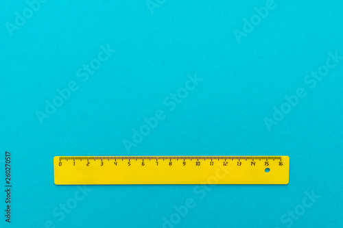 plastic ruler on blue photo