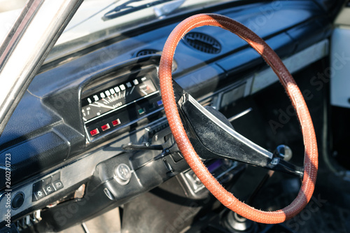Brown steering wheel of a retro car. Retro car salon