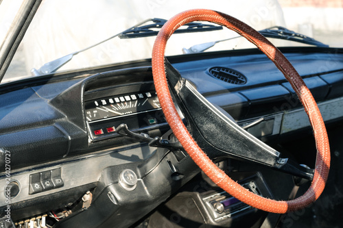 Brown steering wheel of a retro car. Retro car salon