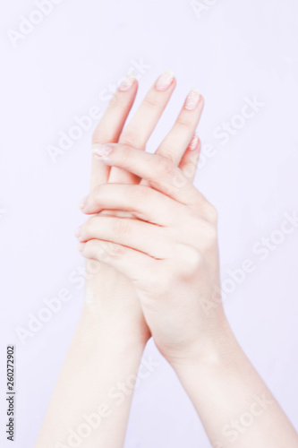 beautiful hands of a girl cream white background