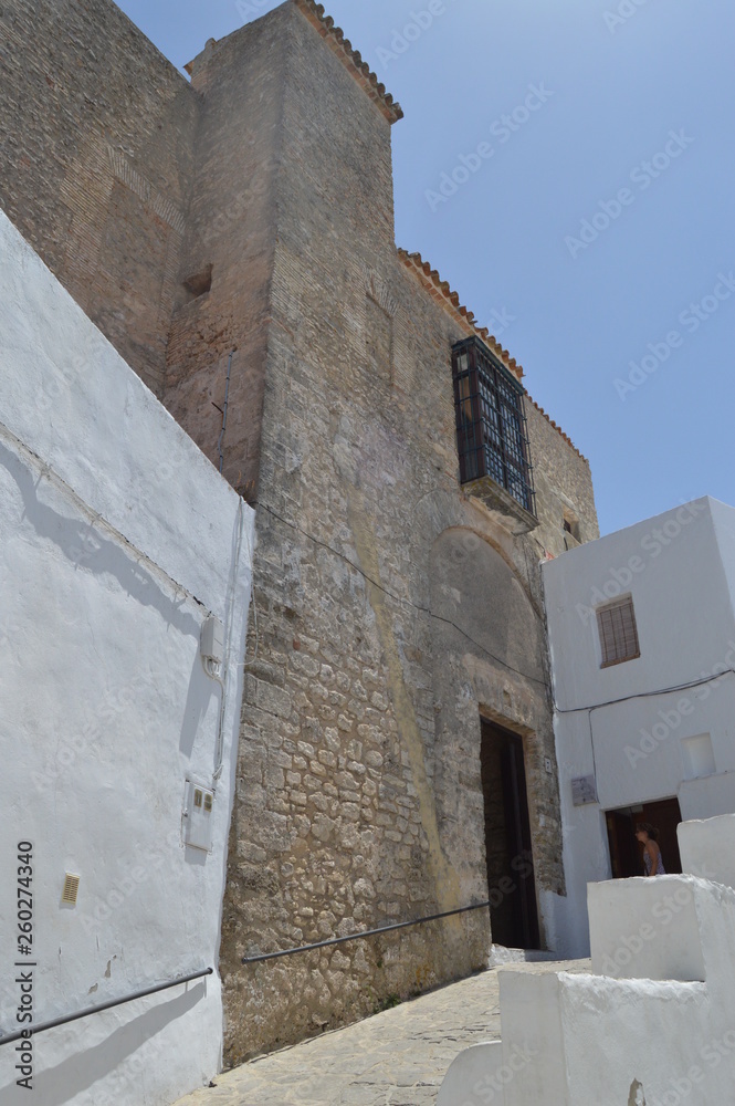 Main Facade Of Medieval Style Castle In Vejer. Nature, Architecture, History, Street Photography. July 12, 2014. Vejer De La Frontera, Cadiz, Spain Main Facade Of Medieval Style Castle In Vejer. Nature, Architecture, History, Street Photography. July 12, 2014. Vejer De La Frontera, Cadiz, Spain