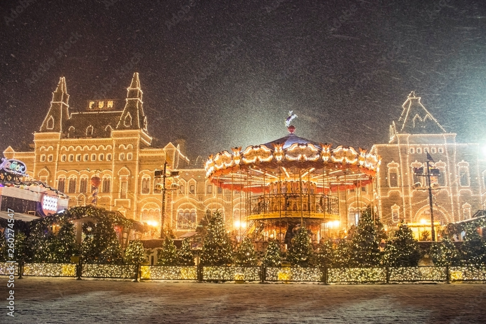 glowing merry-go-round and fair in winter