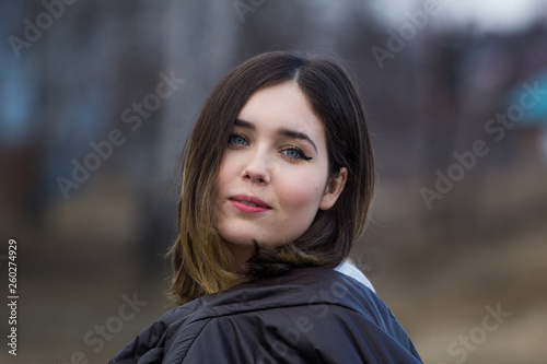 metal dobeautiful brunette at a spring photo shootor keys on a bright sparkling background