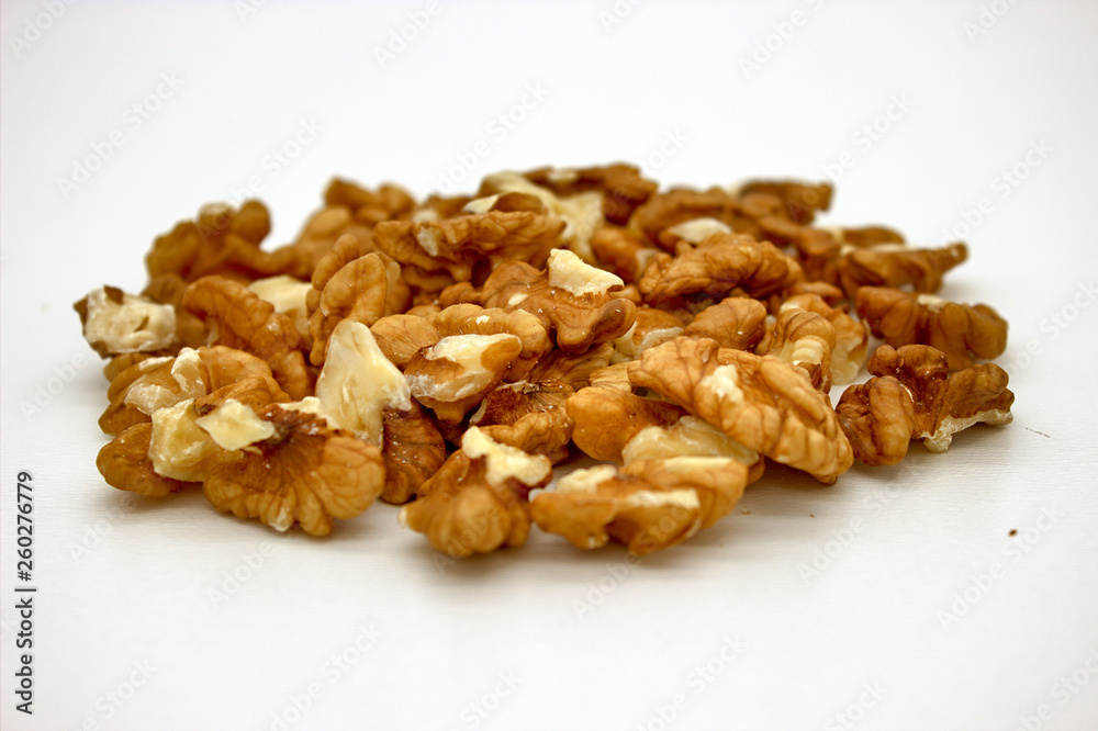 Walnut Kernels (Other Names: Juglans Regia, Persian Walnut, English Walnut, Circassian Walnut). Isolated Image On A White Background Walnut Kernels (Other Names: Juglans Regia, Persian Walnut, English Walnut, Circassian Walnut). Isolated Image On A White Background