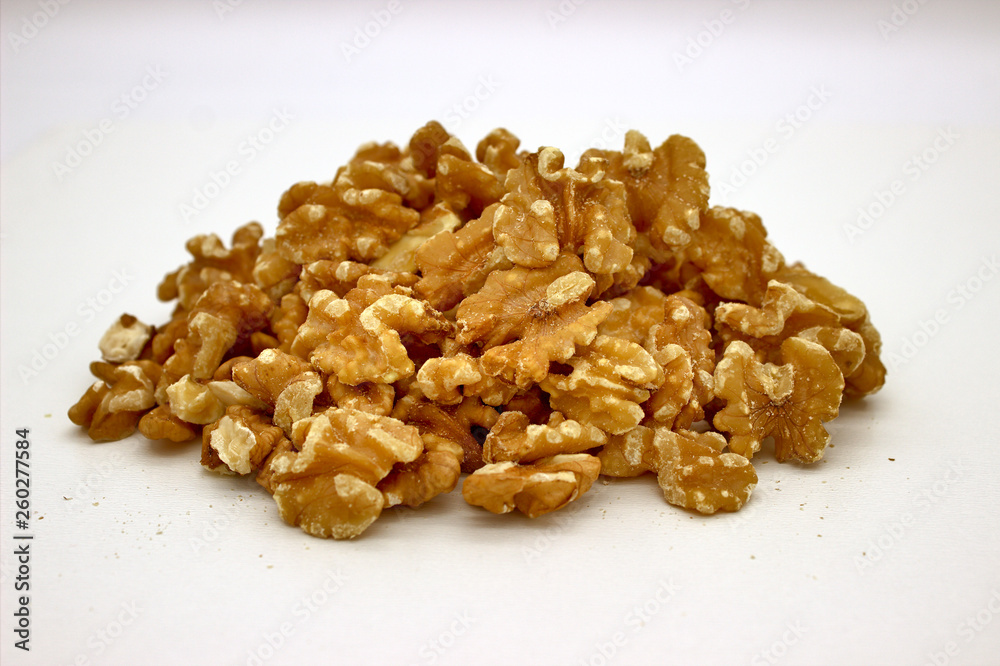 Walnut Kernels (Other Names: Juglans Regia, Persian Walnut, English Walnut, Circassian Walnut). Isolated Image On A White Background Walnut Kernels (Other Names: Juglans Regia, Persian Walnut, English Walnut, Circassian Walnut). Isolated Image On A White Background