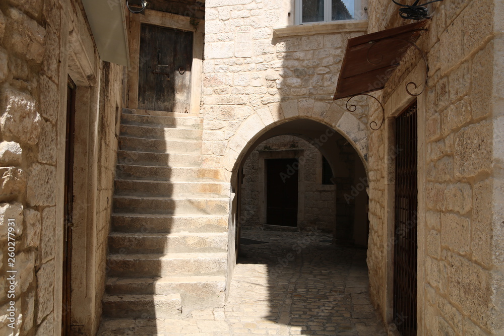 Narrow street of the old town of Trogir, Croatia