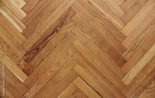 Wooden parquet floor background of oak hardwood texture in apartment building. Interior design with empty seamless brown laminate top view