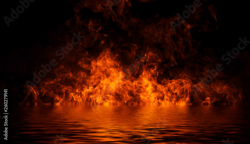 Blaze fire flame texture on isolated background with water reflection.