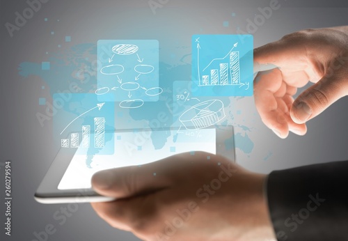 Businessman using tablet pc   on  background