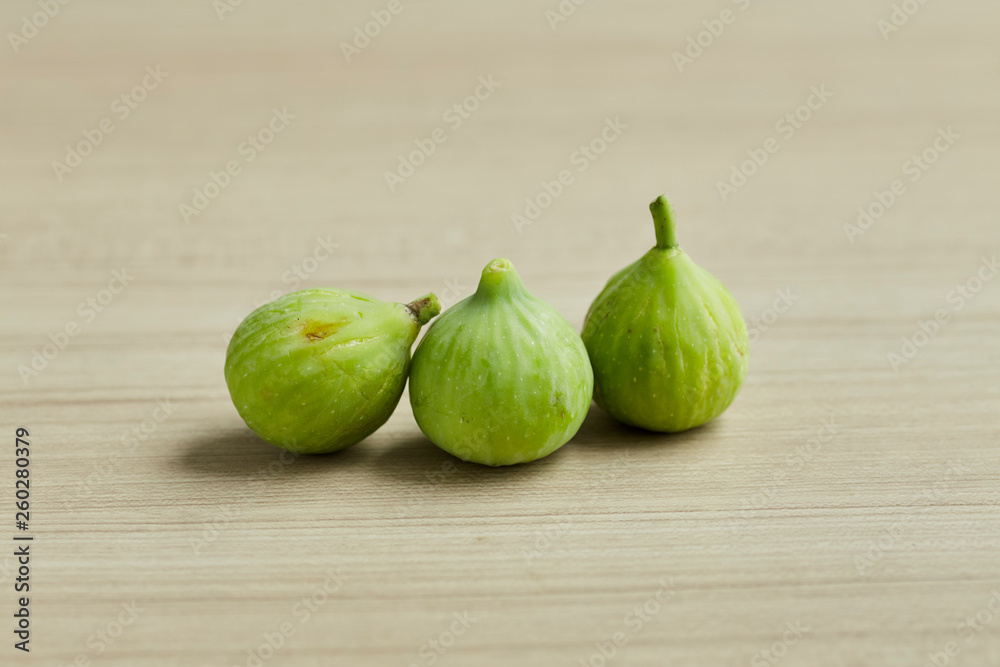 Ripe figs on a on a wooden table Ripe figs on a on a wooden table
