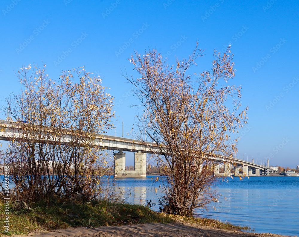 Autumn day in Arkhangelsk. View of the river Northern Dvina and automobile bridge in Arkhangelsk. Autumn day in Arkhangelsk. View of the river Northern Dvina and automobile bridge in Arkhangelsk.