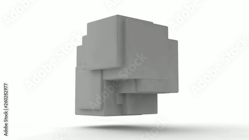 3D animation of rotation of a white cube which splits into a set of cubes and splinters and is restored.