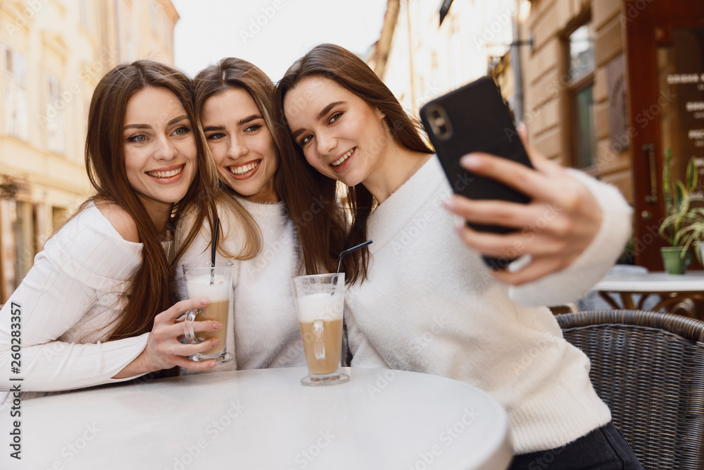 Girlfriends have fun in cafe Girlfriends have fun in cafe