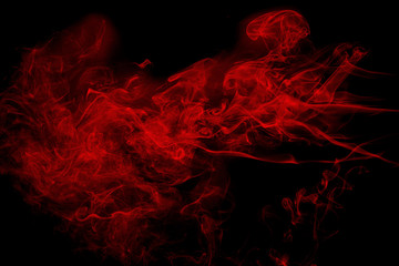 Abstract red  smoke on black background. Dramatic red smoke clouds. Movement of colorful smoke.