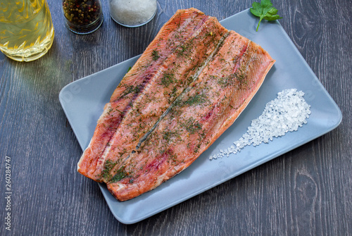 salted red fish with salt, pepper and butter, dill