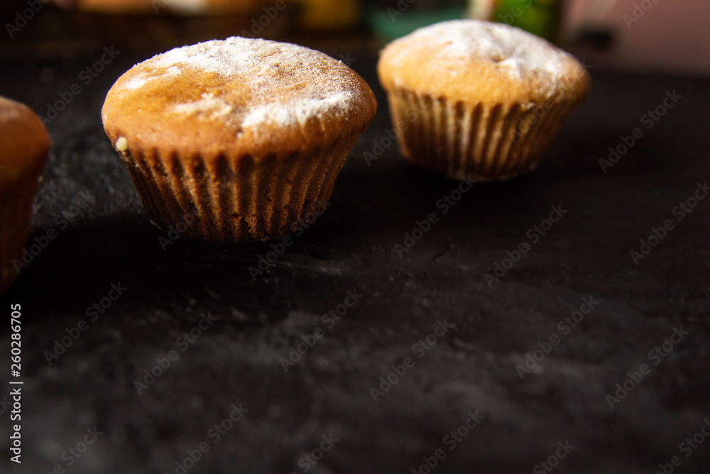 Cakes on a dark stone background Cakes on a dark stone background