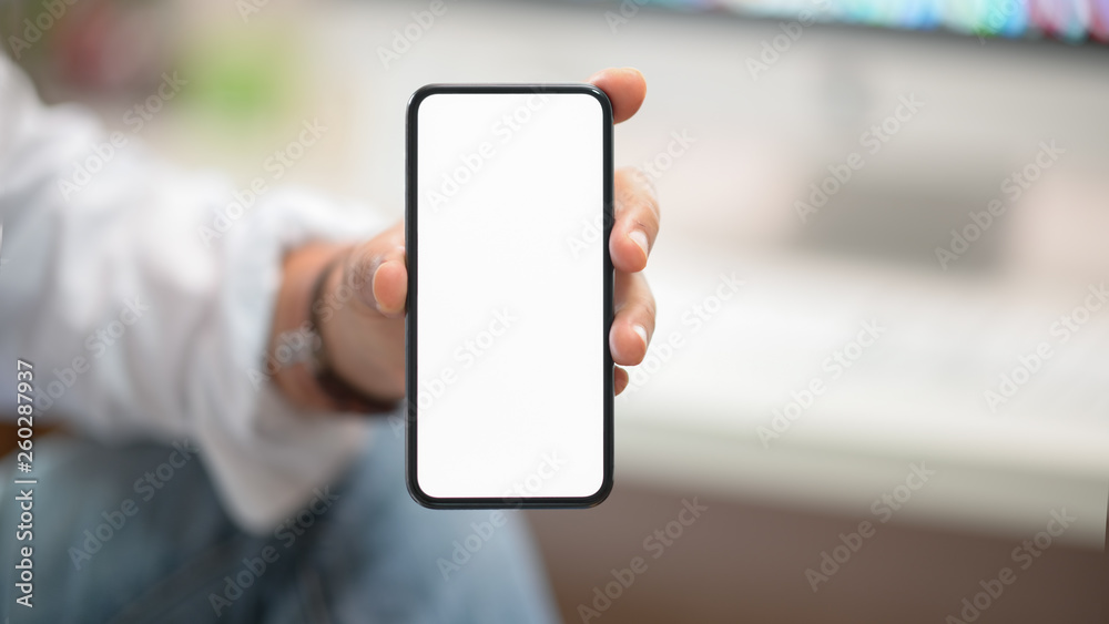 Business man showing blank screen mobile phone in office Business man showing blank screen mobile phone in office