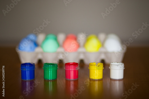 Colorful handmade easter eggs on dark background