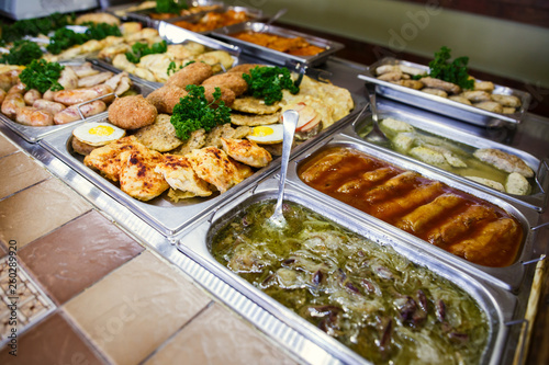A set of meat dishes in the trays