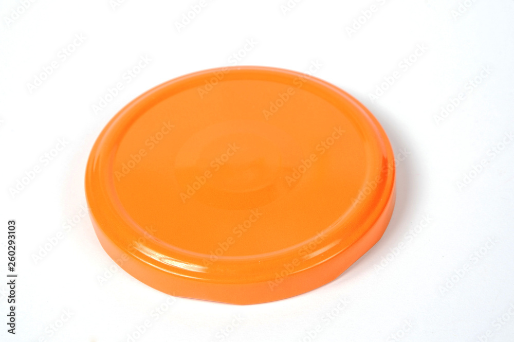 Screw cap for glass jars. For canning, canned food. Orange cap on white background Screw cap for glass jars. For canning, canned food. Orange cap on white background