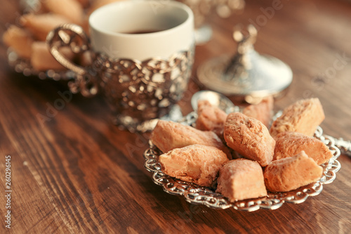 Turkish sweets with coffee on a wooden table