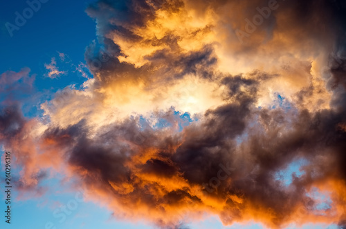 Detail photography of some colorful clouds at sunset over the sky of Villa de Leyva, in the Andean mountains of central Colombia.