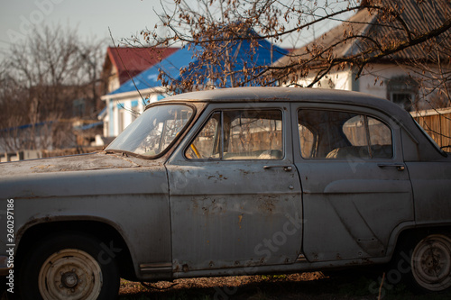 Photo of one old car in the village