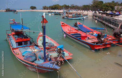 Traditional thai boat at harbour in Thailand