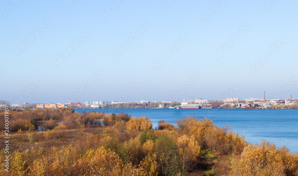 Arkhangelsk. Autumn day. View of the old buildings and berths of the timber processing plant 