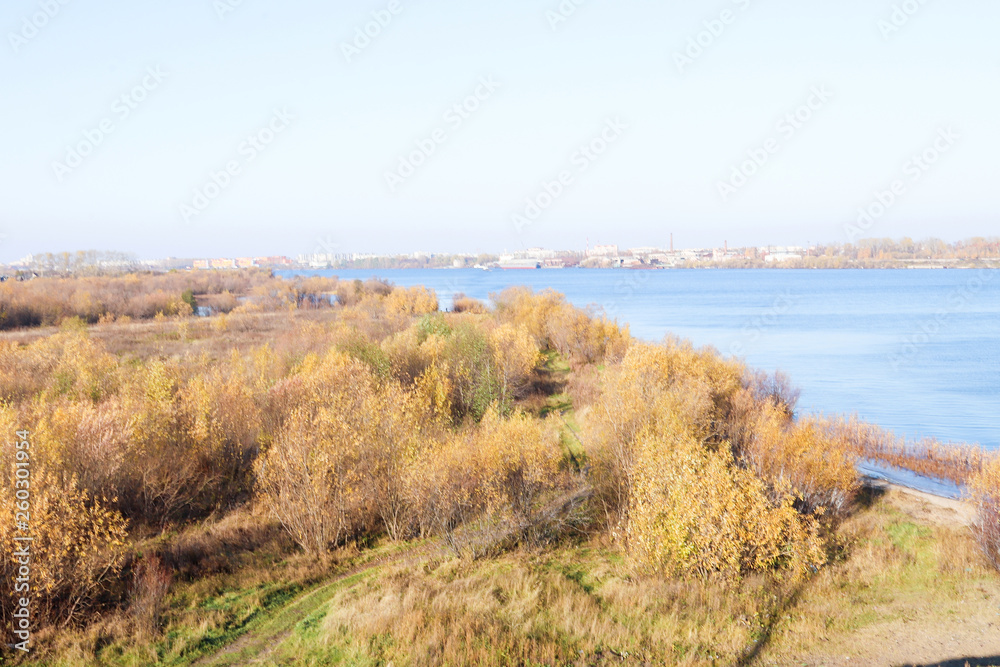 Arkhangelsk. Autumn day. View of the old buildings and berths of the timber processing plant Arkhangelsk. Autumn day. View of the old buildings and berths of the timber processing plant