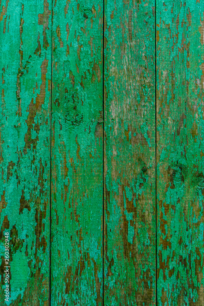 Obraz premium Old wooden background of boards with cracked and peeling paint