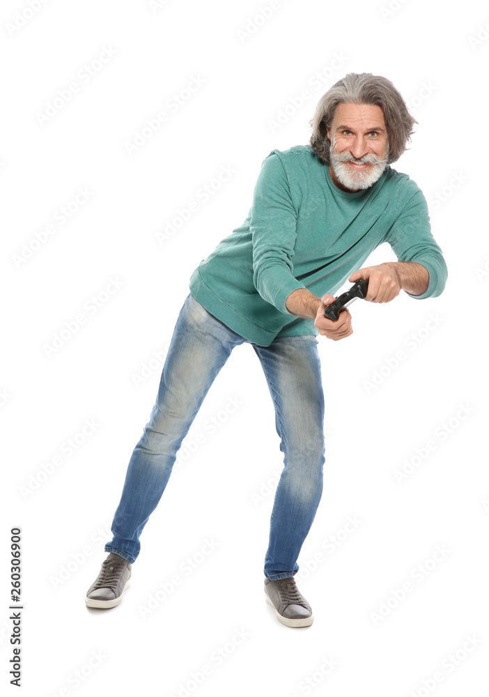 Emotional mature man playing video games with controller isolated on white Emotional mature man playing video games with controller isolated on white