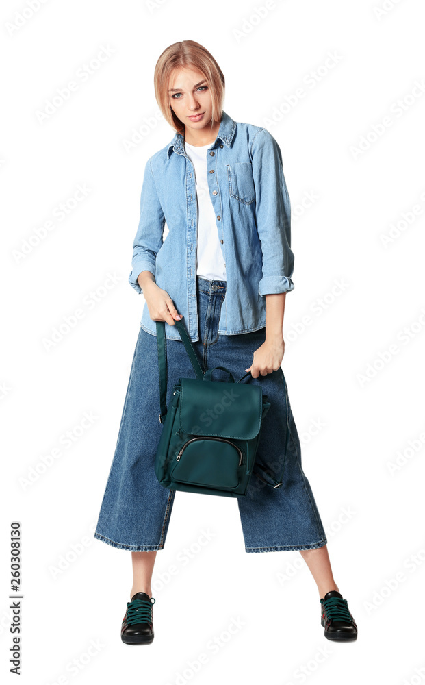 Full length portrait of woman in stylish shoes holding backpack isolated on white Full length portrait of woman in stylish shoes holding backpack isolated on white