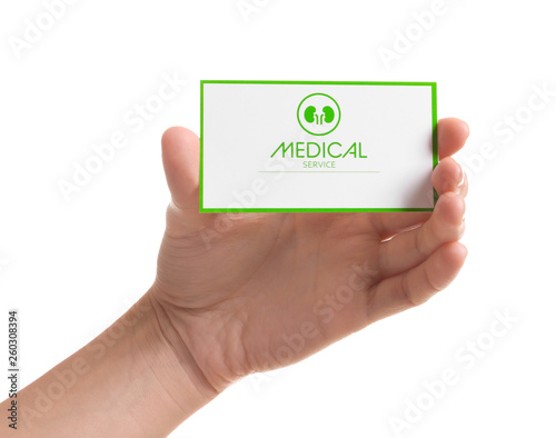 Woman holding medical business card isolated on white, closeup. Nephrology service