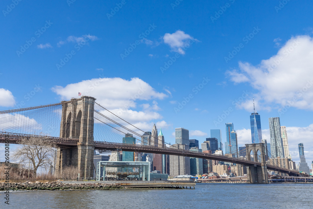 Brooklyn Bridge with Manhattan downtown and Cityscape on sunny day with clear blue sky New York USA