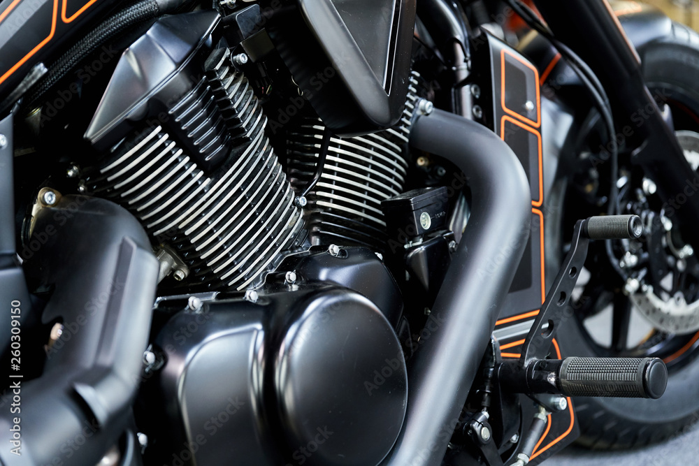 The powerful engine of a modern motorcycle closeup. The layout of the motor The powerful engine of a modern motorcycle closeup. The layout of the motor