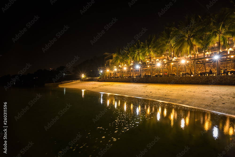 beautiful and luxury restaurant under the lights at the shore at night
