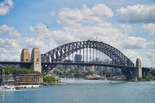 SYDNEY - OCTOBER 2015: Panoramic view of Sydney Harbor on a sunny day. The city attracts 20 million people annually © jovannig