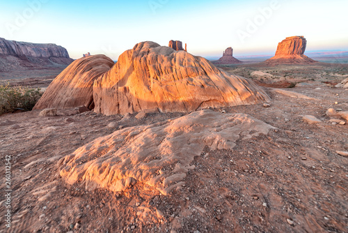 Red rocks of Monument Valley on a clear summer day photo
