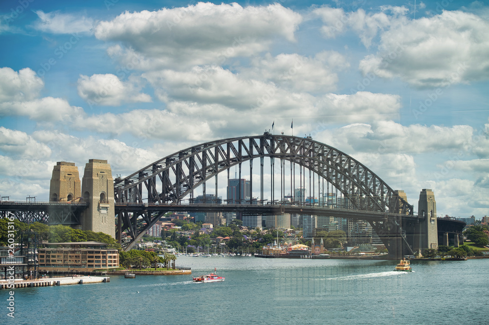 SYDNEY - OCTOBER 2015: Panoramic view of Sydney Harbor on a sunny day. The city attracts 20 million people annually SYDNEY - OCTOBER 2015: Panoramic view of Sydney Harbor on a sunny day. The city attracts 20 million people annually
