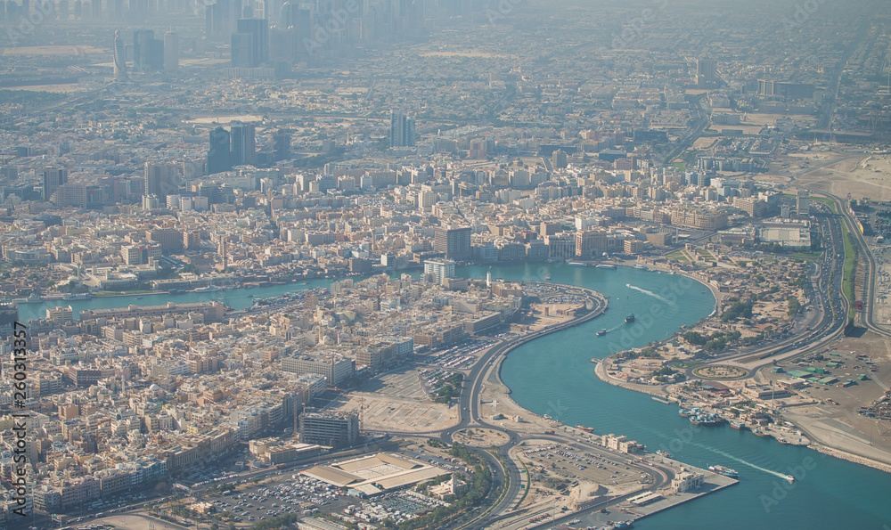 Aerial view of Dubai Creek from the airplane at sunrise