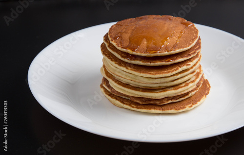 Delicious warm morning pancakes on a white plate