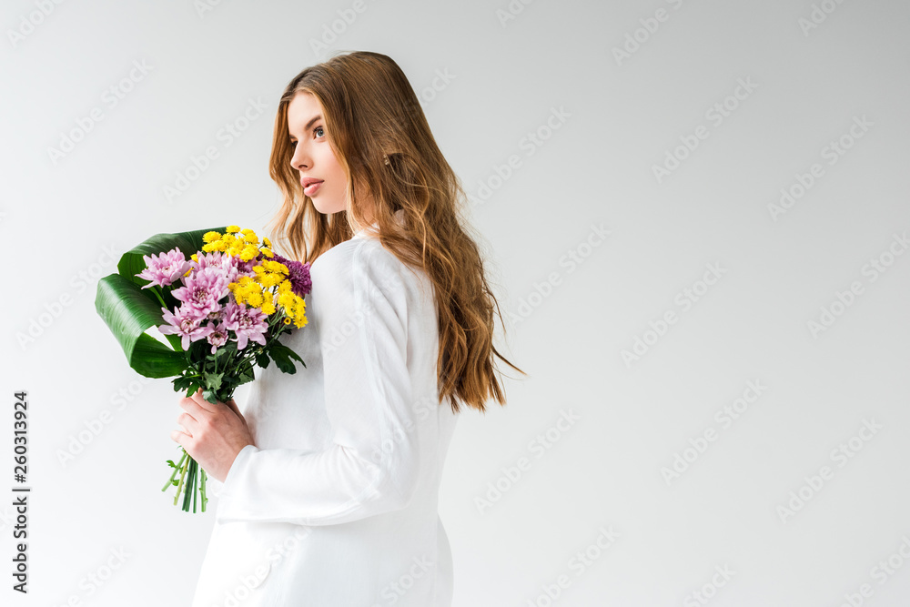 dreamy girl holding bouquet of wildflowers on white dreamy girl holding bouquet of wildflowers on white