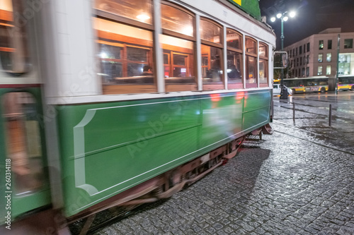 Green tram in Lisbon at night