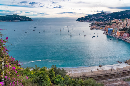 Villefranche-sur-Mer, beautiful bay in winter, with boats and Saint-Jean-Cap-Ferrat in background 