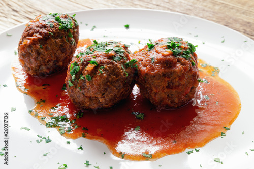 kofta in tomato sauce decorated with parsley