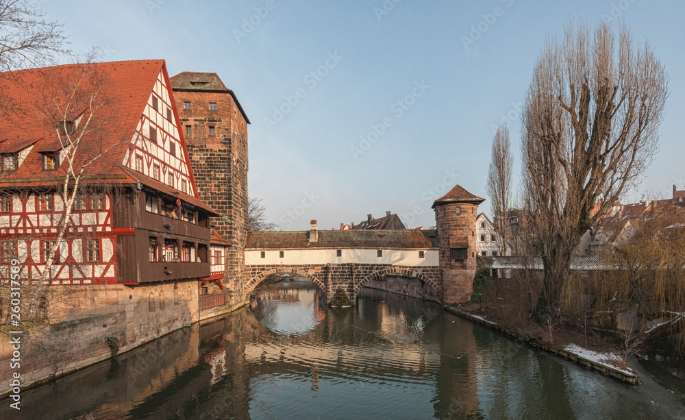 The famous Weinstadl and Wasserturm (Water Tower) over the river Pegnitz and  Henkersteg and Henkerhaus  seen from Maxbrücke - Nuremberg, Germany 