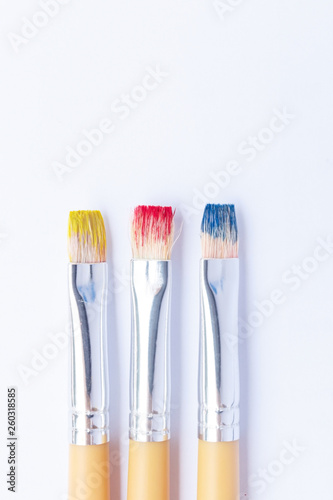 Three primary colors on white background.Red  blue and yellow color brushes.